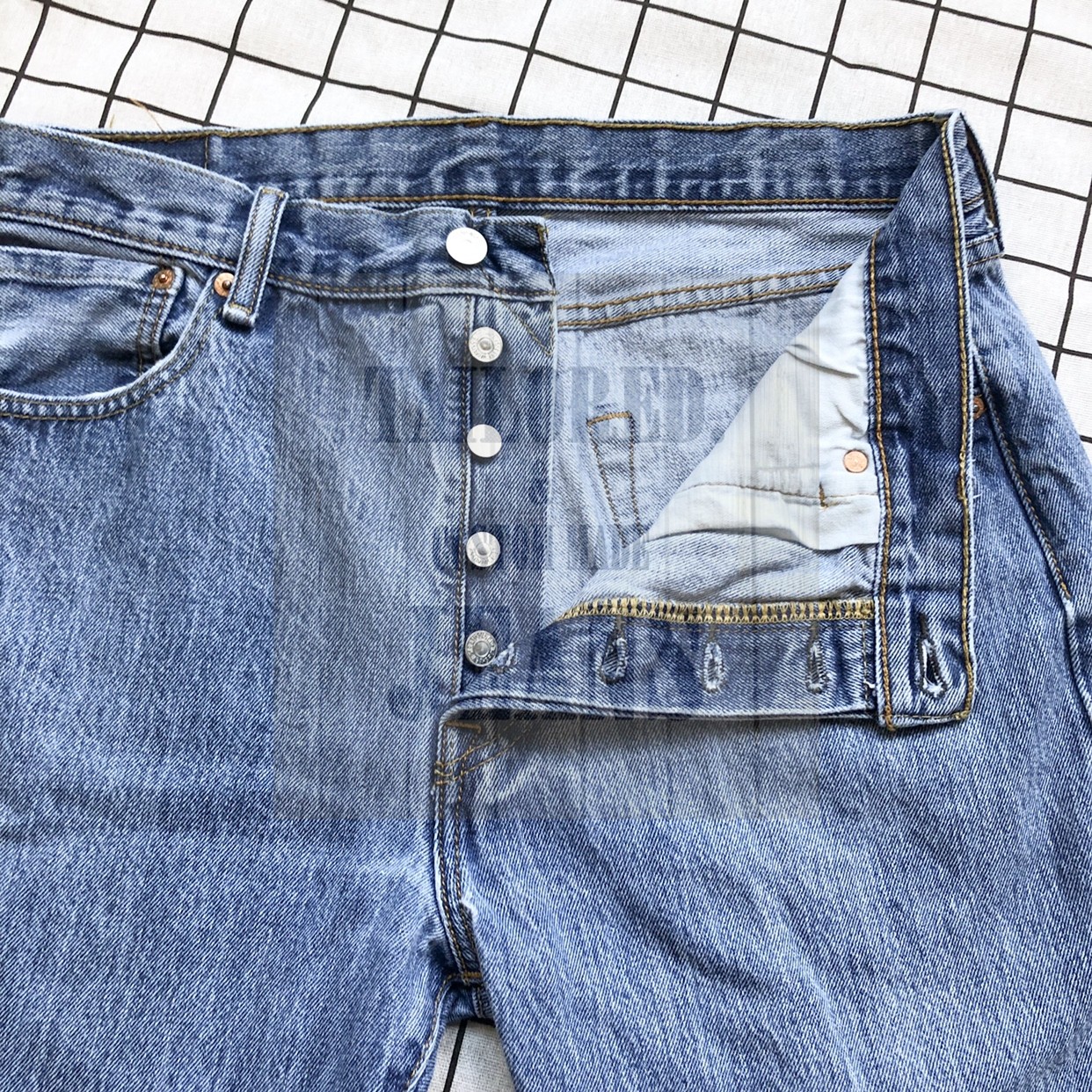 The button fly Jeans.